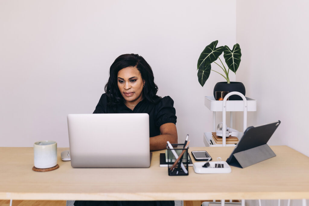 Black woman working at her desk