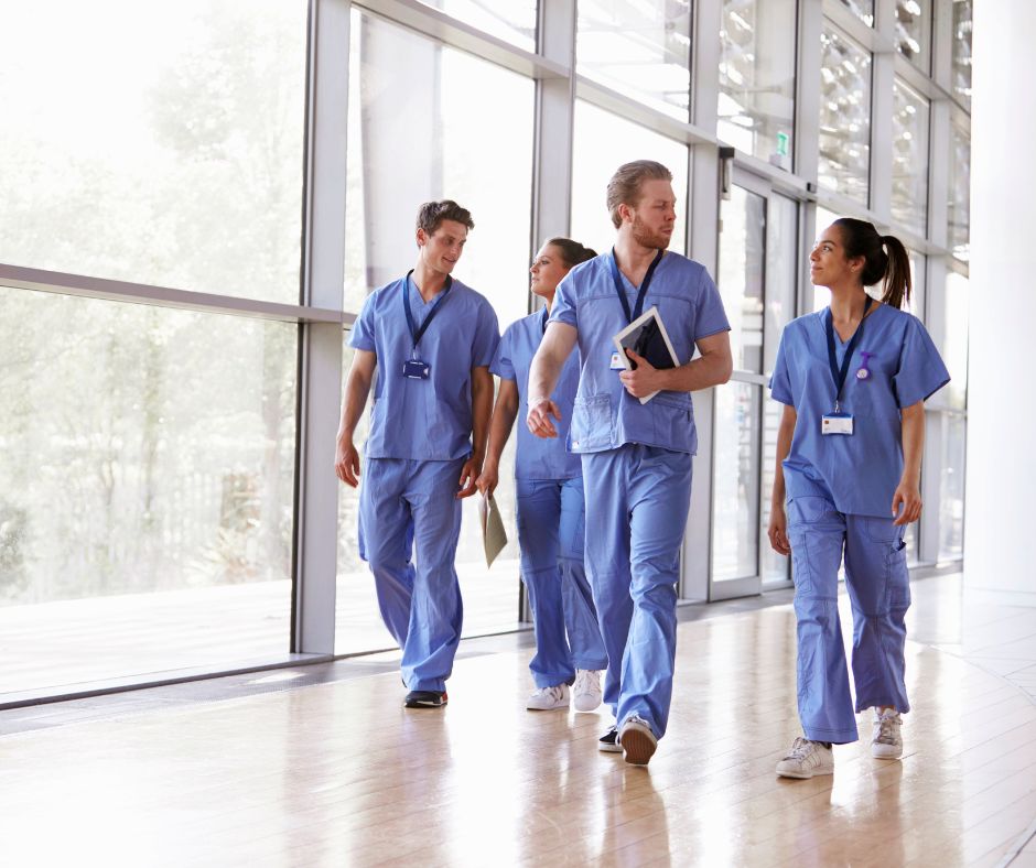 Doctors talking while walking down hall